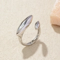 Macro view of a polished silver adjustable ring featuring a unique droplet design - Adjustable Open / Silver Almond
