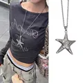 Detailed macro view of a vintage silver starfish pendant on a thin metal chain link - Vintage Silver Star Texture Style (12#)