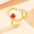 Elegant gold-tone hollow geometric stainless steel ring featuring a red zircon gemstone - Inlaid Red Zirconia / Gold with Red Stone