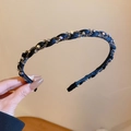 Detailed view of handmade braided headband with shimmering rhinestones on black fabric - 64# Headband - Black - Diamond Twist