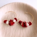 Close-up of gold hoop earrings with red resin beads and white pearls in a ceramic dish - Silver Earring Post-Gold-Red