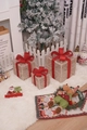 Three gold Christmas gift boxes with red bows and warm LED lights for festive decor - Gold Silk Christmas Gift Box