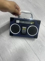Blue retro radio shaped handbag with metallic handle and realistic speaker dial details - Blue