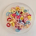 Elastic hair ties in various vibrant macaron colors with durable high stretch material - Light Color Series 100Pcs OPP Bag