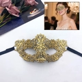 Elegant gold embroidered lace masquerade mask with floral patterns and black ribbons - Flower Heart