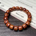 Bracelet ethnique en bois de santal avec perles tonnelet, grain naturel et poli - Palissandre de Madagascar 10x11mm