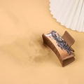 Brown western style hair claw clip featuring an artistic elephant pattern on leather texture - Brown / Elephant Pattern