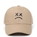 Khaki cotton baseball cap featuring a black embroidered sad boy face design - Khaki