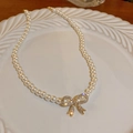 Double-layer pearl necklace featuring a gold bow pendant with sparkling rhinestones - Gold Bow Single Layer Style (9# Necklace)