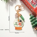 Porte-clés boule à neige de Noël avec bonhomme de neige, pompon vert et mousqueton doré - Style Bonhomme de Neige de Noël