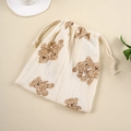 Close-up of muslin cotton drawstring bag with bear print and soft crinkle texture - Double Bears