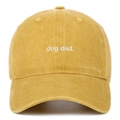 Detail of embroidered dog dad text on ginger washed cotton baseball cap with white background - Adjustable / Yellow