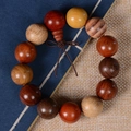 Polished multi-colored redwood bead bracelet with a traditional Chinese woven knot - Multicolor (18mm*13 Beads Regular)
