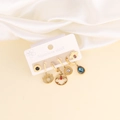 Detail of stainless steel earring set with moon, star, and bee motifs on a display card - Bee Stripe and Evil Eye Element Style (1#)