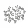 Varios conectores de cadena de bolas de acero inoxidable para joyería sobre fondo blanco - 1.2mm / Color Acero