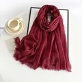 Detail of wine red cotton linen scarf with frayed edges on a white table setting - 185*90cm / Carmine
