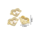 Detailed view of gold heart pendant with shell inlay and cubic zirconia, 1.6cm x 2.3cm size - Double Heart Handplate (Natural Shell)