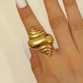 Macro shot of gold seashell ring featuring detailed spiral texture and metallic finish - Conch Form Style (7413) / Gold