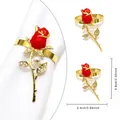 Elegant gold napkin ring featuring a red rose with pearl and rhinestone details - Pearl Red Rose