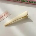 Matte cream beige minimalist plastic hair clip on a clean white aesthetic background - Light Yellow