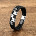 Detail view of multi-layer black braided leather bracelet with silver magnetic metal clasp - Black & White