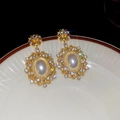 Macro shot of pearl drop earrings with crystal halo on a vintage ceramic plate - Gold Plated Pearl Rhinestone (925 Sterling Silver Earring Post)