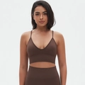 Close-up of chocolate brown seamless yoga set with ribbed support and high-waist leggings - Brown