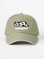 Close-up detail of cartoon cow embroidery and MOOOOODY text on washed khaki cotton cap - Light Khaki