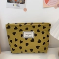 Yellowish green corduroy makeup bag with black heart patterns and zipper closure - Dark Yellow Khaki Heart