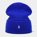 Detailed close-up of blue knitted beanie featuring a white embroidered letter N on the cuff - One Size / Blue