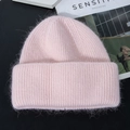Close-up of the plush rabbit fur texture on a light pink knitted winter beanie hat - M (56-58cm) / Pink