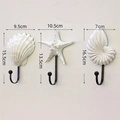 3-piece white resin ocean theme wall hooks featuring seashell starfish and snail shapes - White Mediterranean Set of 3