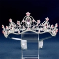 Close-up of silver bridal crown featuring pink crystal rhinestones on an acrylic stand - Silver Pink