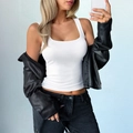 Slim fit Y2K style white ribbed tank top vest for women styled with a black leather jacket - S / White
