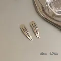 Dettaglio di fermagli per capelli in metallo argento da 4,7 cm con finitura lucida - Argento Metallico - Goccia d'acqua / 1 pezzo