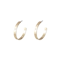 Detailed view of gold C-shaped earrings with hollow star cutouts on a white background - Star Hollow Large Hoop / Gold