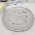 Detail of beaded necklace with pink starfish pendants on white ceramic plate - Off-white Beads + Light Pink Starfish Necklace