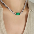Silver Cuban link necklace with rectangular green gemstone worn on beige knitwear - Steel Color Green Glass Stone Necklace