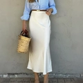 Elegant white satin midi skirt featuring a high-waisted design and smooth glossy finish - L / White