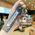 Space shuttle floating bottle keychain with astronaut and gold liquid sand detail - UFO Astronaut - Skateboard