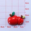 DIY resin red apple charm for Christmas crafts with glossy finish on grid mat - Apple Cushion