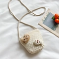 Beige woven straw shoulder bag for girls featuring a cute plush cat and fish decor - Cat