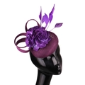 Elegant purple linen fascinator hat with handmade flowers and feathers on mannequin - Deep purple