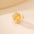 Macro detail of golden openwork bead with white zircon inlay for DIY bracelet making - Gold Hollow Carved