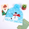 Close-up of LED knit Christmas hat featuring blue snowman pattern and ON/OFF switch - Light Blue Single Snowman