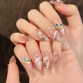 Uñas postizas almendradas rosa ojo de gato con perlas, strass y texturas marinas - XS / Forma de Almendra