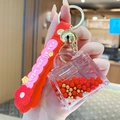 Red bear keychain with acrylic liquid bag charm and golden bell on silicone strap - Pearl Handbag - Red