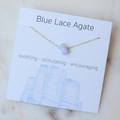 Blue Lace Agate irregular crystal pendant on a gold chain displayed on white card - Blue Lace Agate