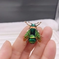 Green enamel honey bee brooch with zircon accents in a gold-tone insect pin design - Style 16