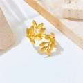 Detailed macro shot of a golden olive leaf open ring made of polished stainless steel - Gold Branch Open Ring